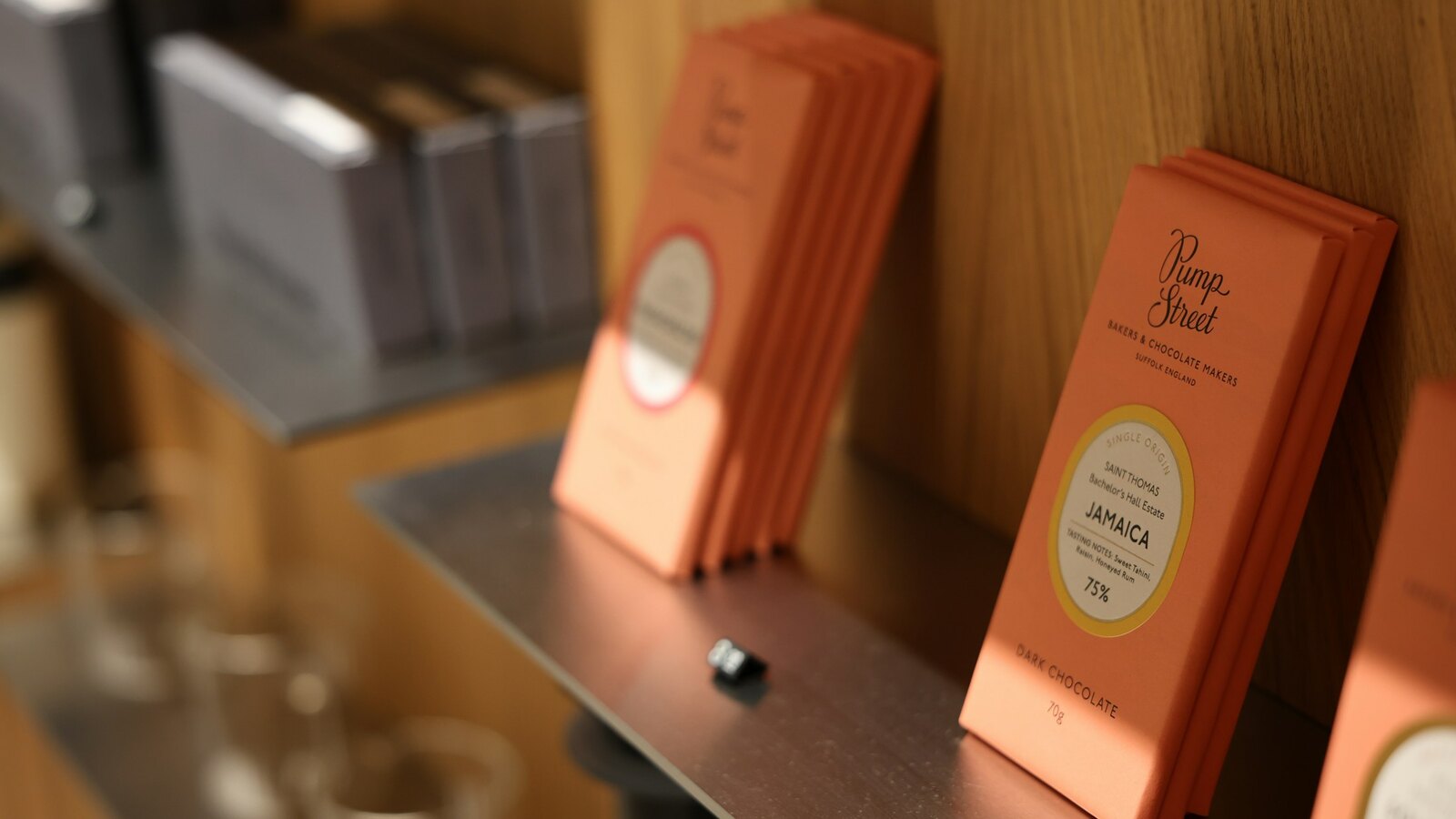 Single origin chocolate bars on a wooden board