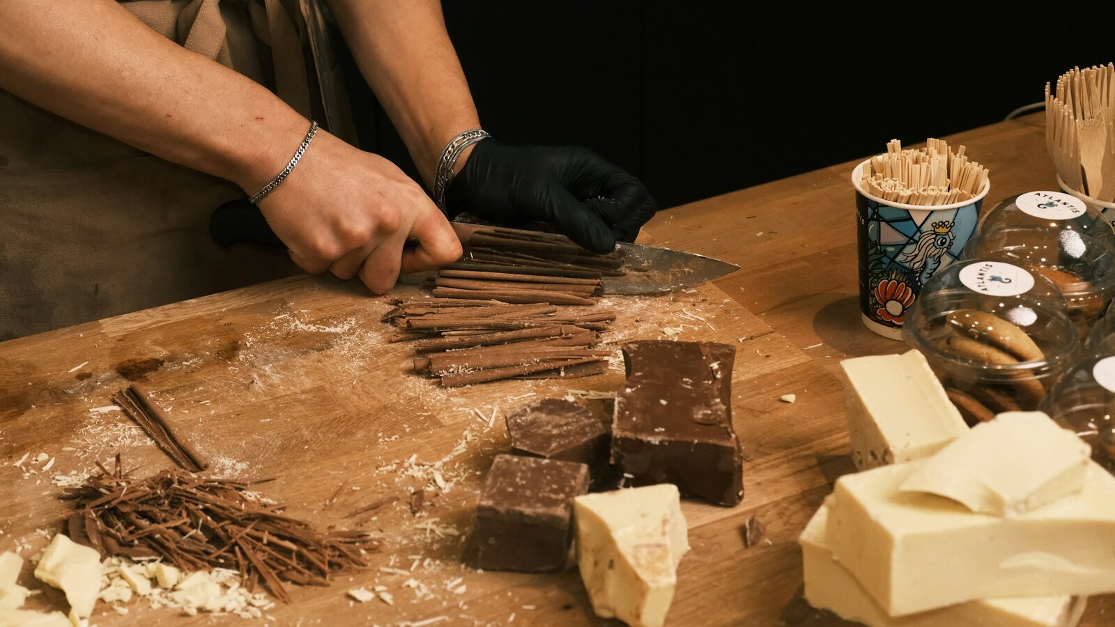 Hands moulding chocolate at a workshop